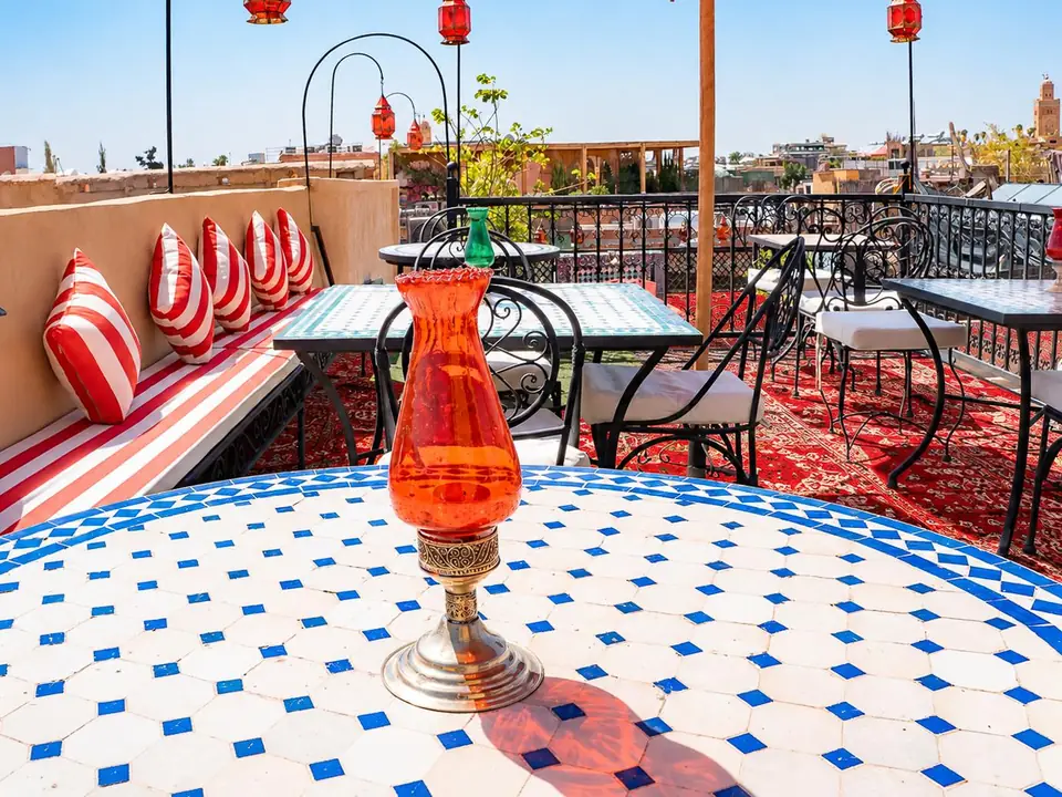 A blue and white zellige table on the terrace