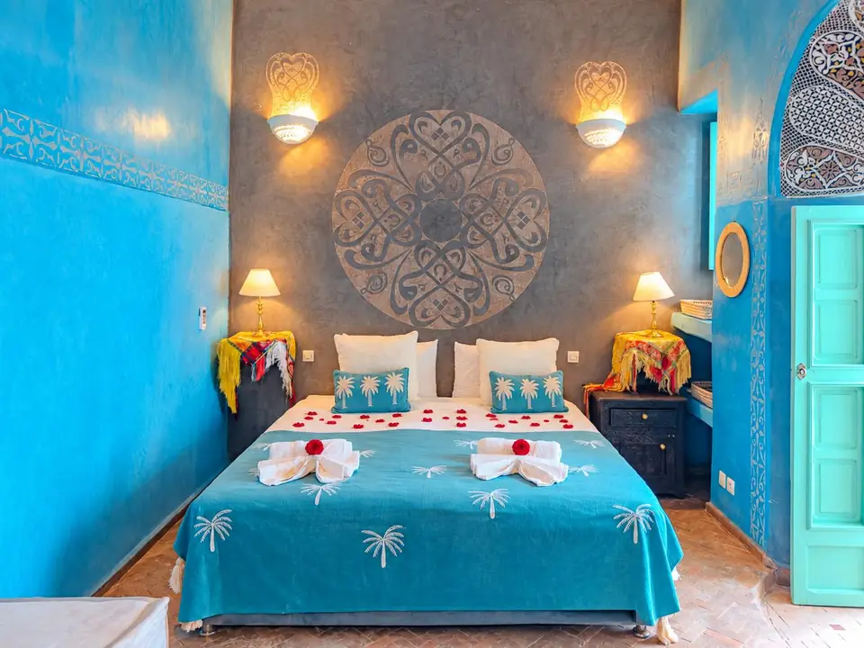 Majorelle room with sky-blue walls and a carved medallion