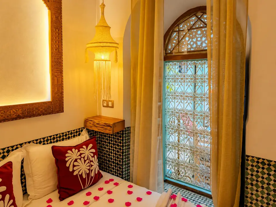 A carved window and lantern in the Zellige room