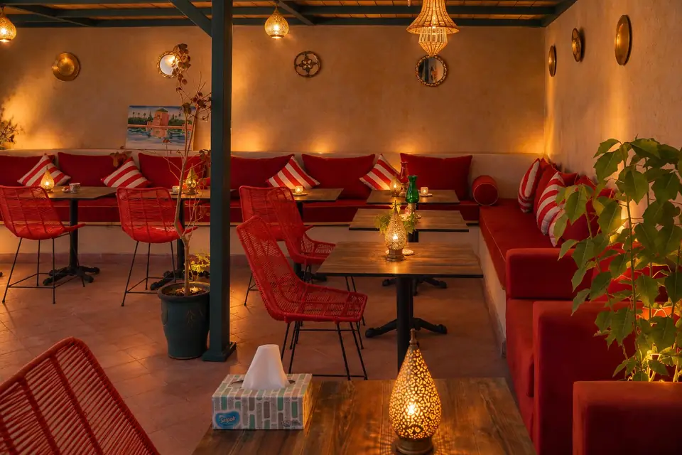The dining lounge with lanterns, red chairs and banquettes